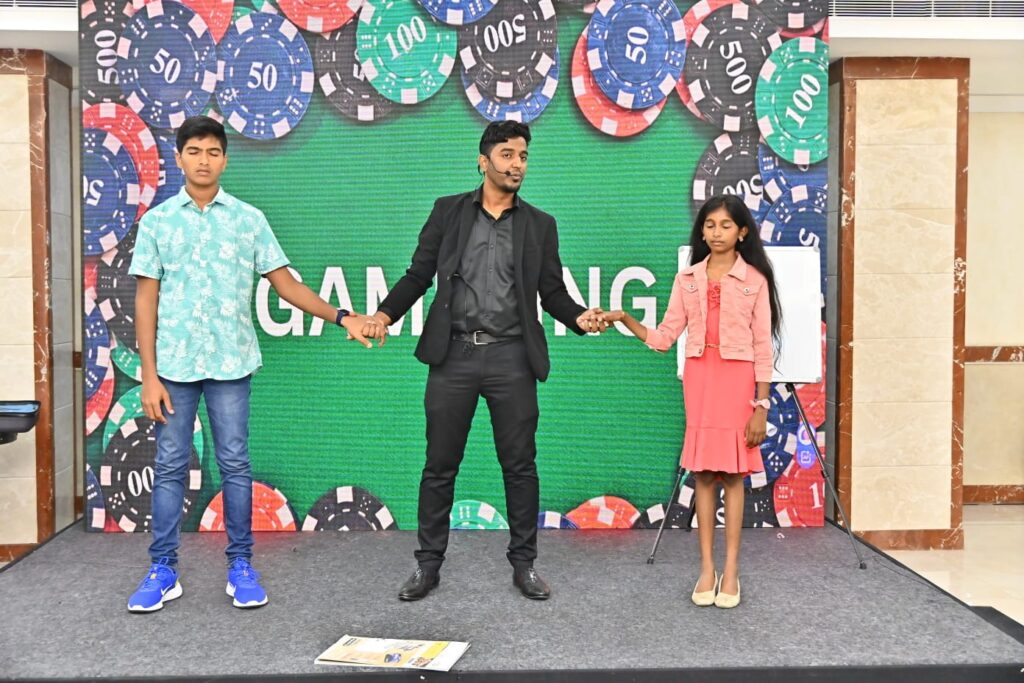 Corporate mentalist performing at a vibrant corporate event, engaging a captivated audience with mind-reading tricks and interactive entertainment.