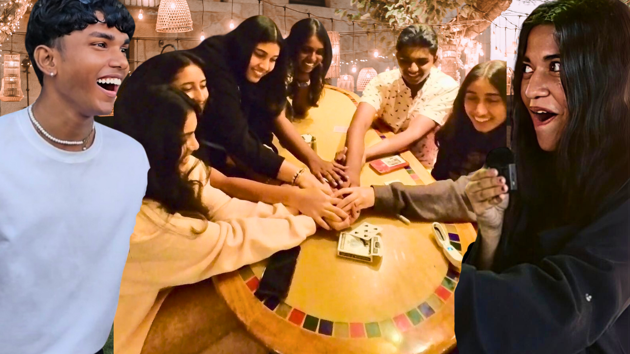 A professional wedding magician in Chennai performing an interactive magic trick for a bride and groom during their wedding reception. The magician, dressed in a stylish blazer, is astonishing the crowd with a blend of close-up illusions and mind-reading effects. The background features joyful wedding guests of all ages laughing and applauding. This vibrant and colorful image captures the essence of modern wedding entertainment in Chennai — fun, unforgettable, and unique.